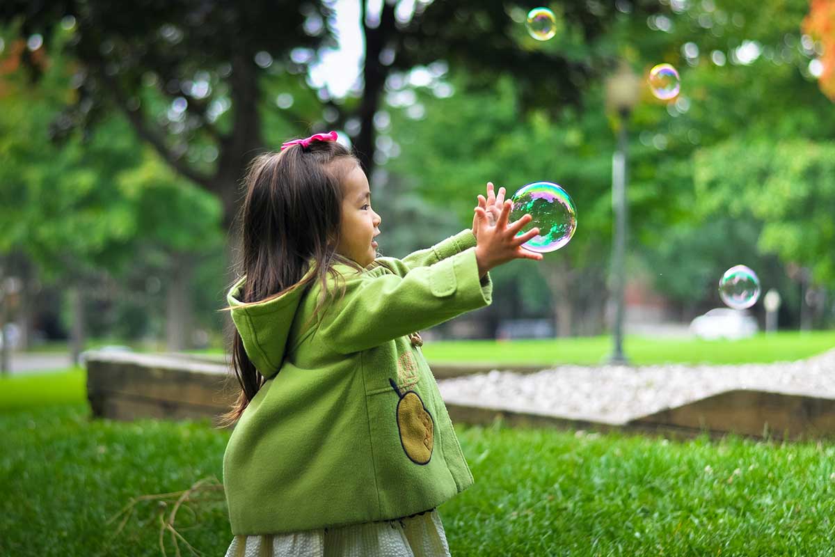 Girl Playing Bubbles